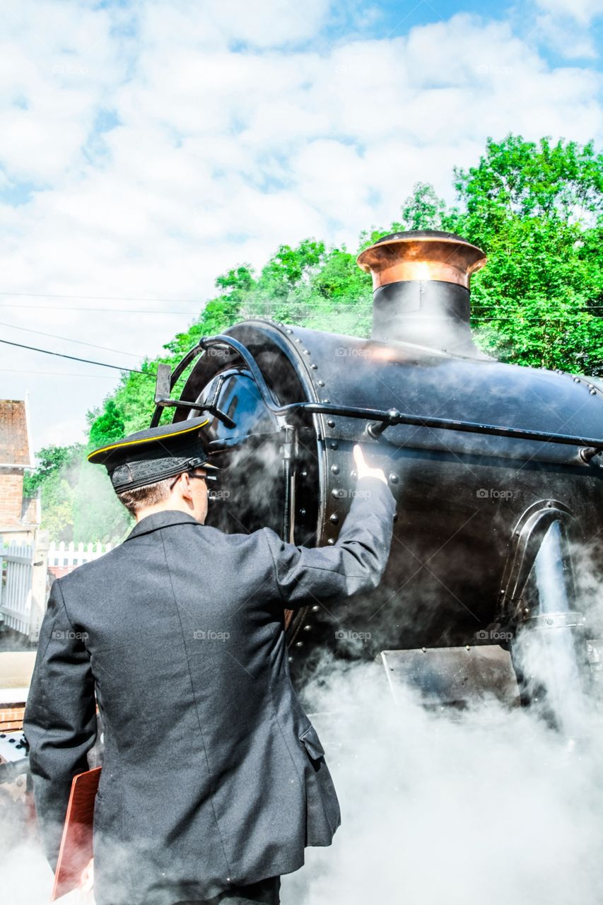 Train conductor and steam train