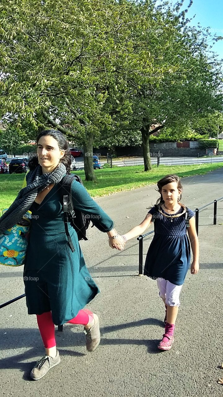 Mother leading Child away