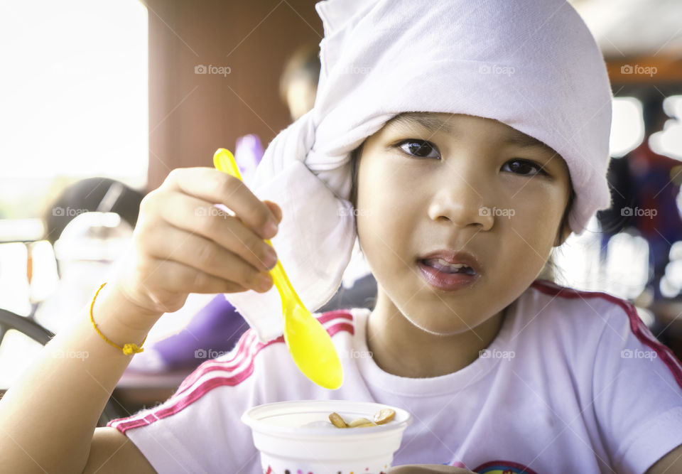 Asian girl having ice cream