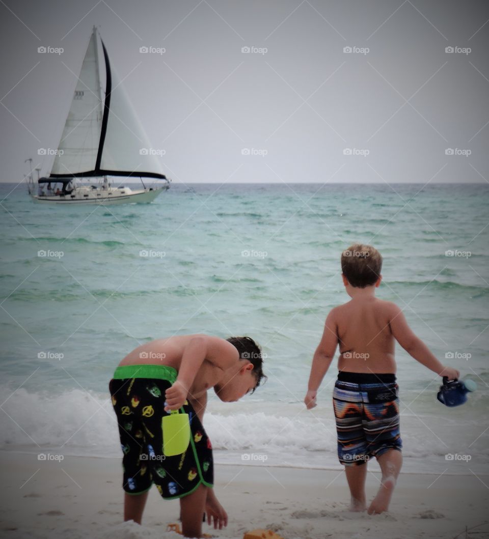 Boys, beach and boat