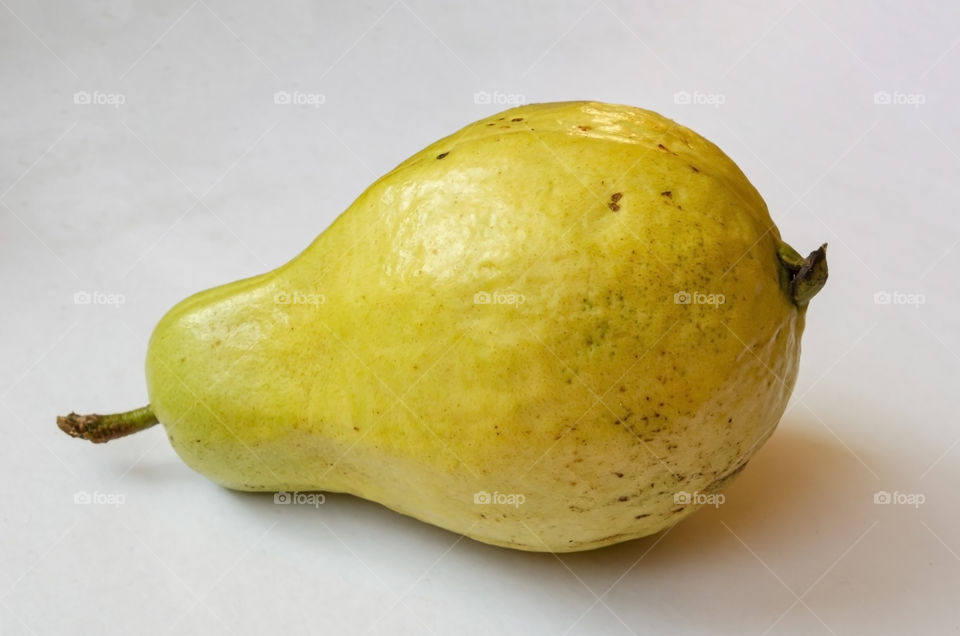 An Isolated Pear Shape Guava On White Background