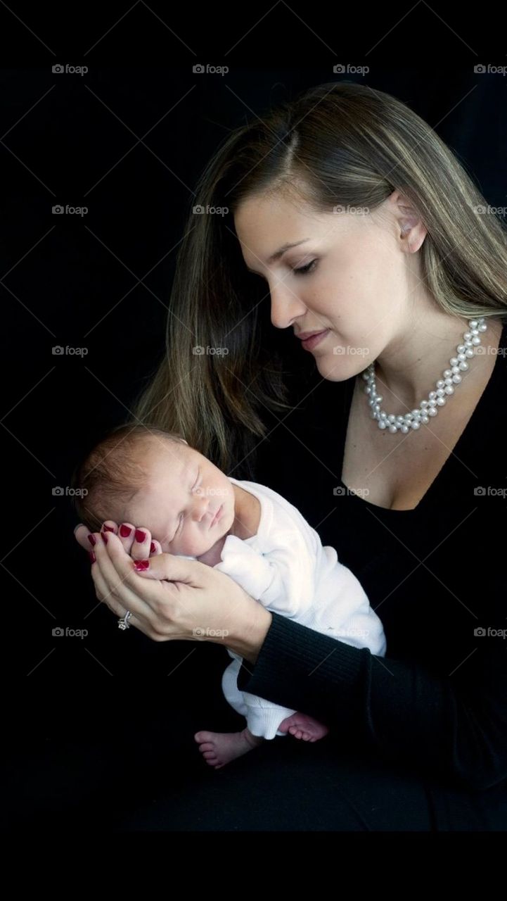 Mom Looking at Newborn Baby Boy