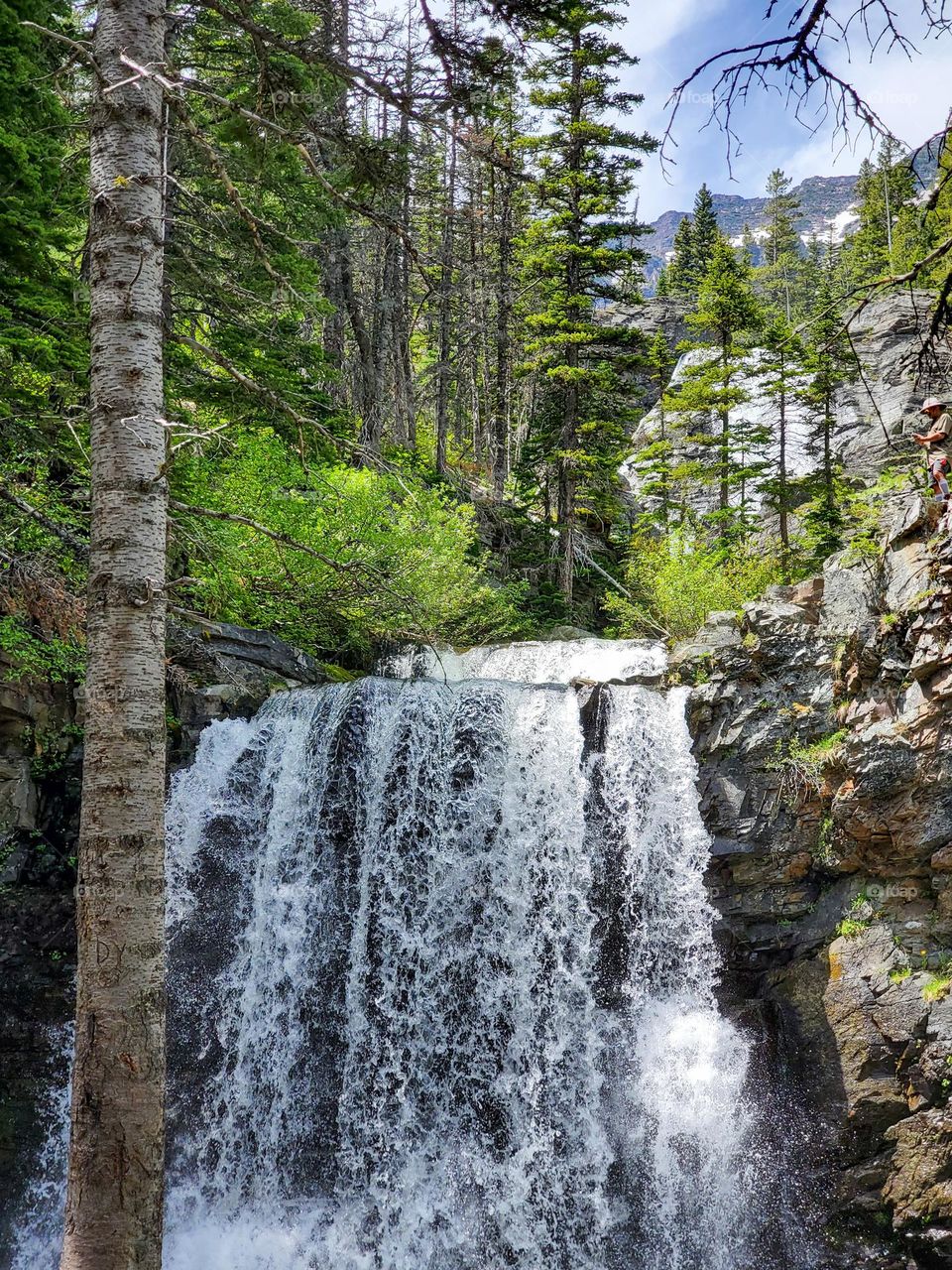 Water flows off a mountain from a glacial source, creating cold and crystal clear ponds and streams