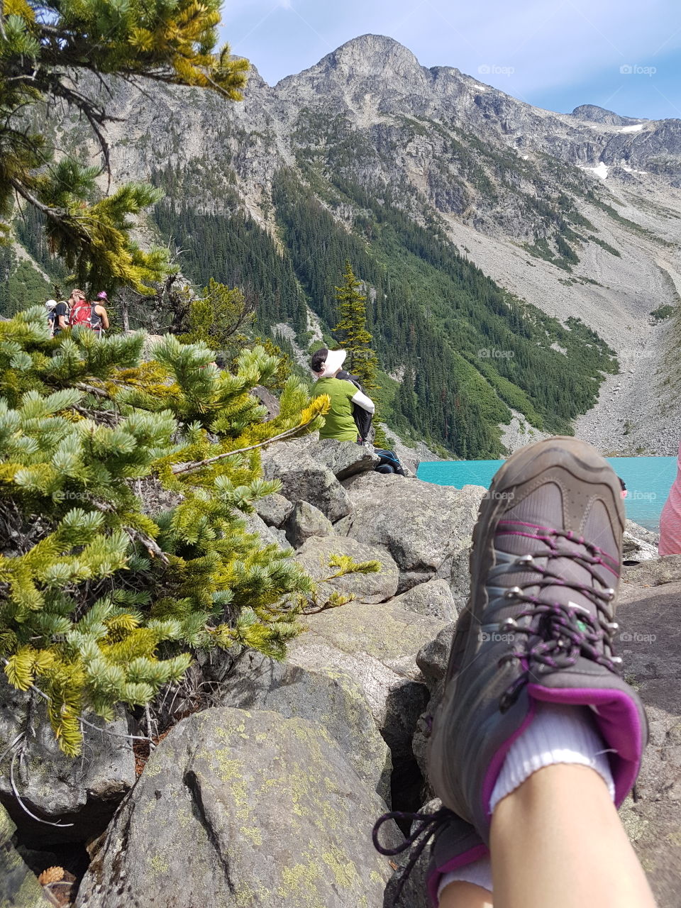 putting up the hiking boots and having a lunch break after the climb to the upper lake at Joffre Lakes near Pemberton, BC.