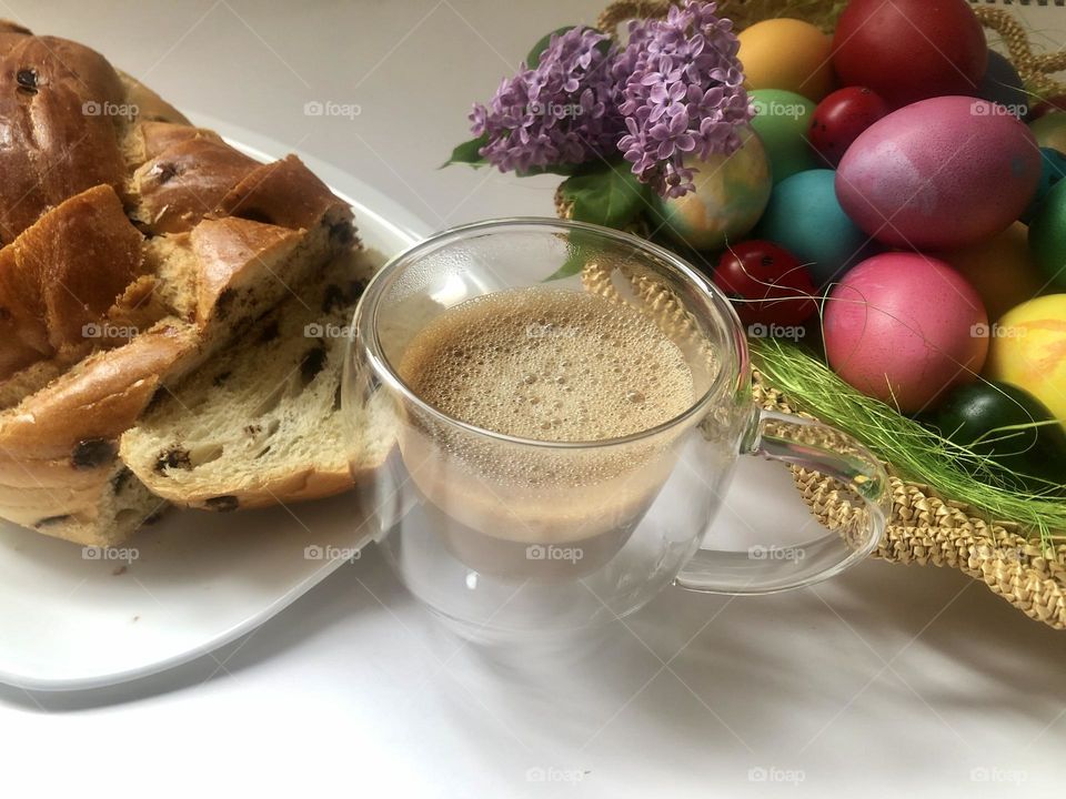 Easter eggs, kozunak and cup with coffee