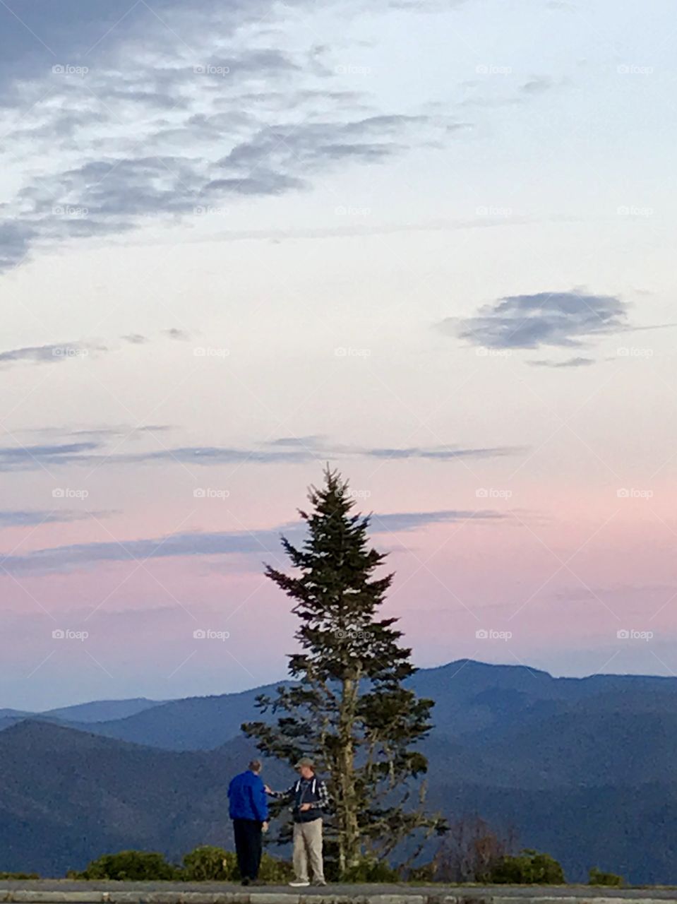 Two men, a tree and mountain range after mountain range - an awe inspiring sight.  