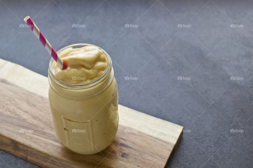Peach smoothie in mason jar