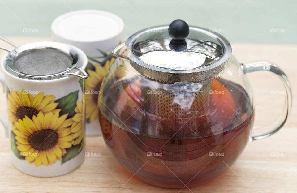 Freshly brewed tea with mugs