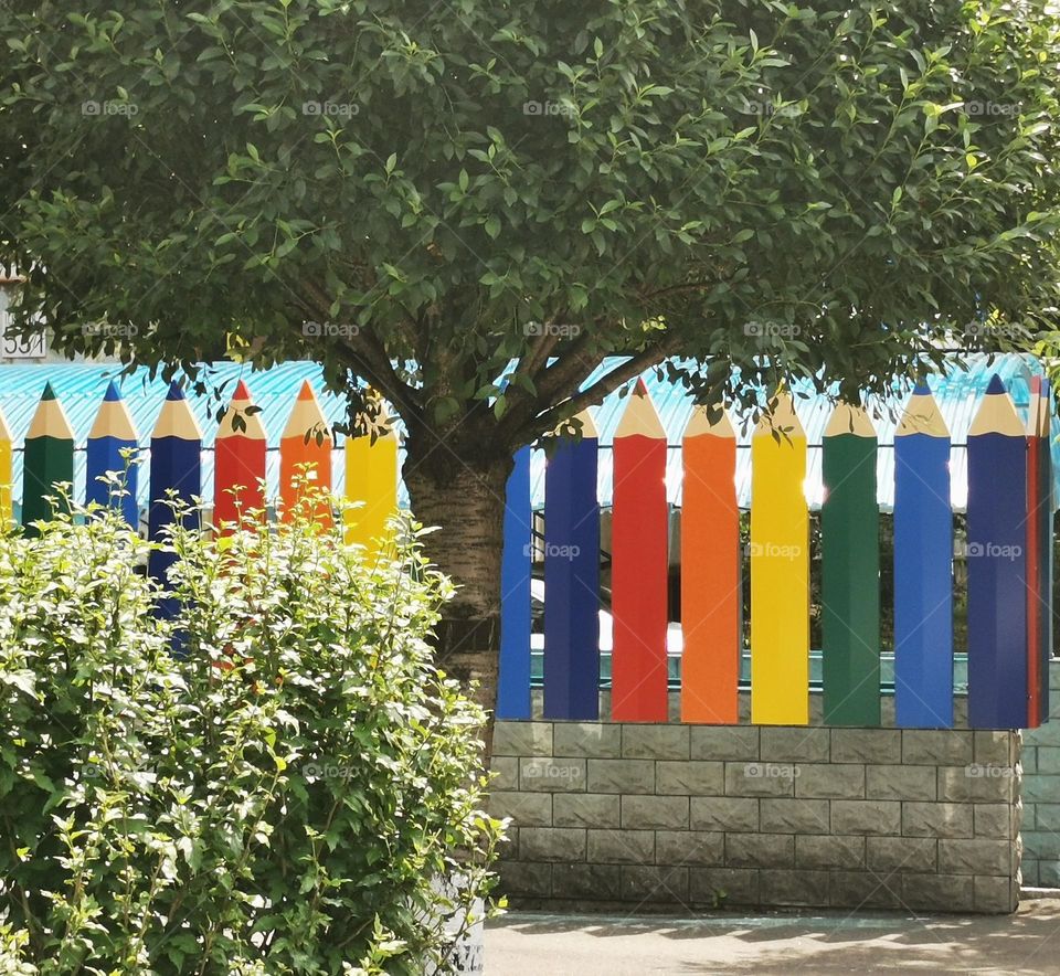 Fence in the colors of the rainbow