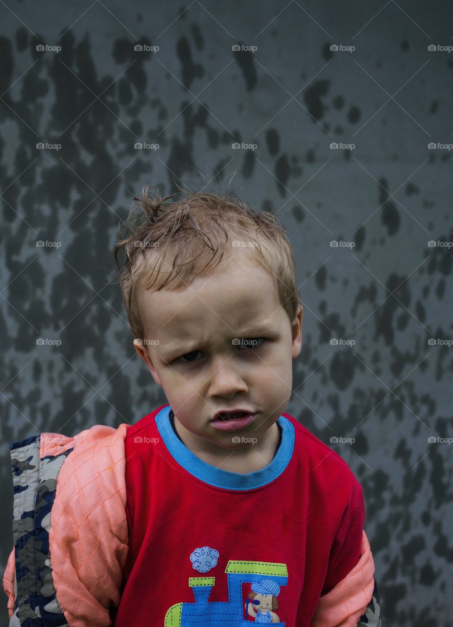 Small boy boy happy with rain ) 