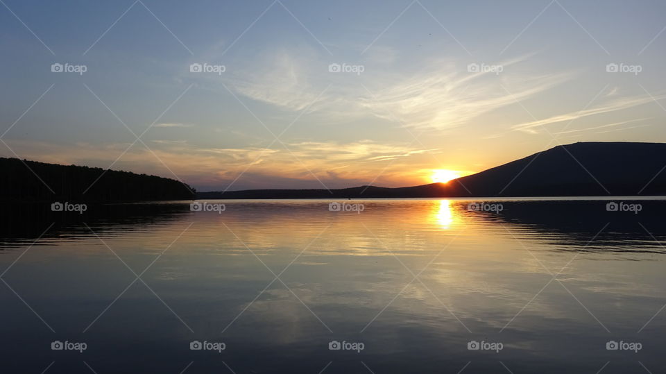 summer sunset over the mountain Kachkanar in the Urals in Russia