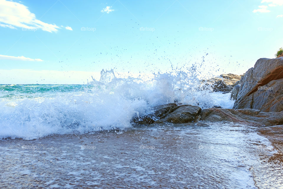 Waves breaking against the rocks