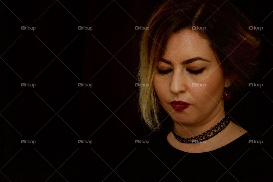 Woman With Short Hair On Black Background