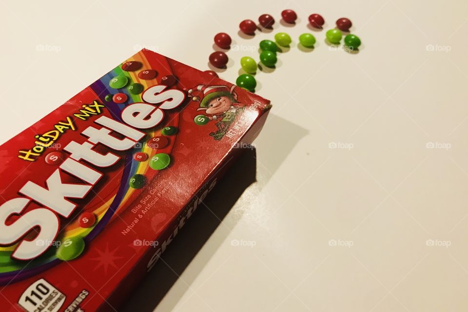 Skittles on display on a white background 