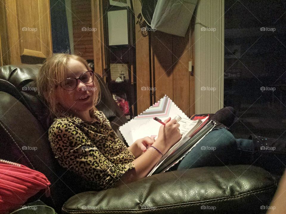 Homework time in dad's chair