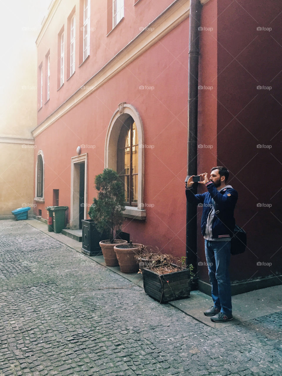 Man photographing through his smartphone