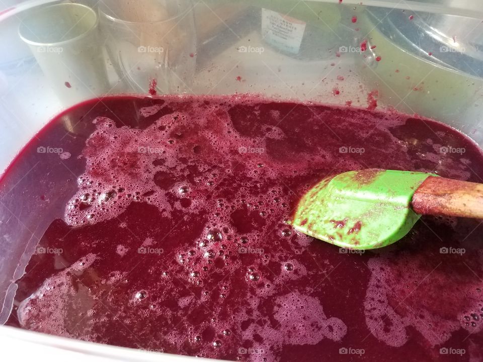 Making homemade grape jelly.