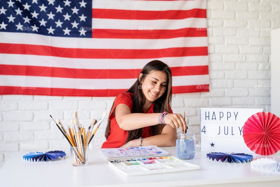 woman holding USA flag