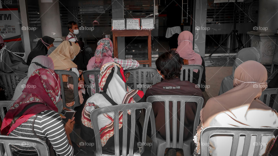 People Queueing in Bank