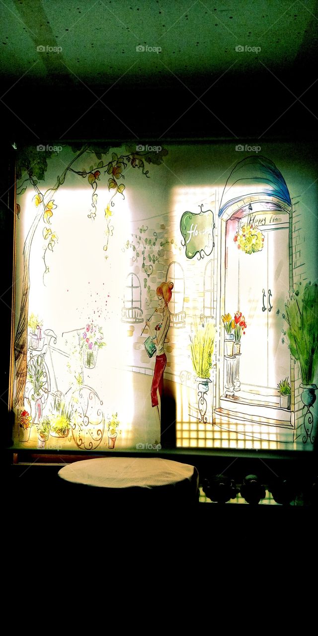 the paintings on the window cover.