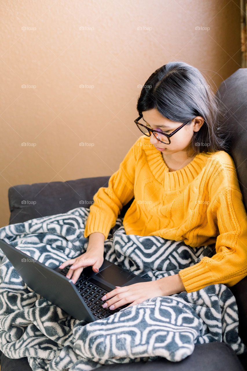 Girl typing on laptop 