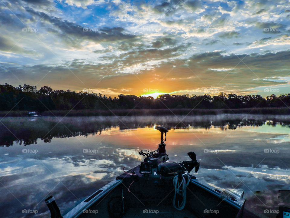 Sunrise from the fishing boat at the cabin lake while on summer vacation