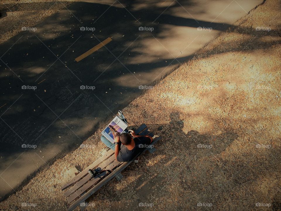 drone photography "book reading in the park"