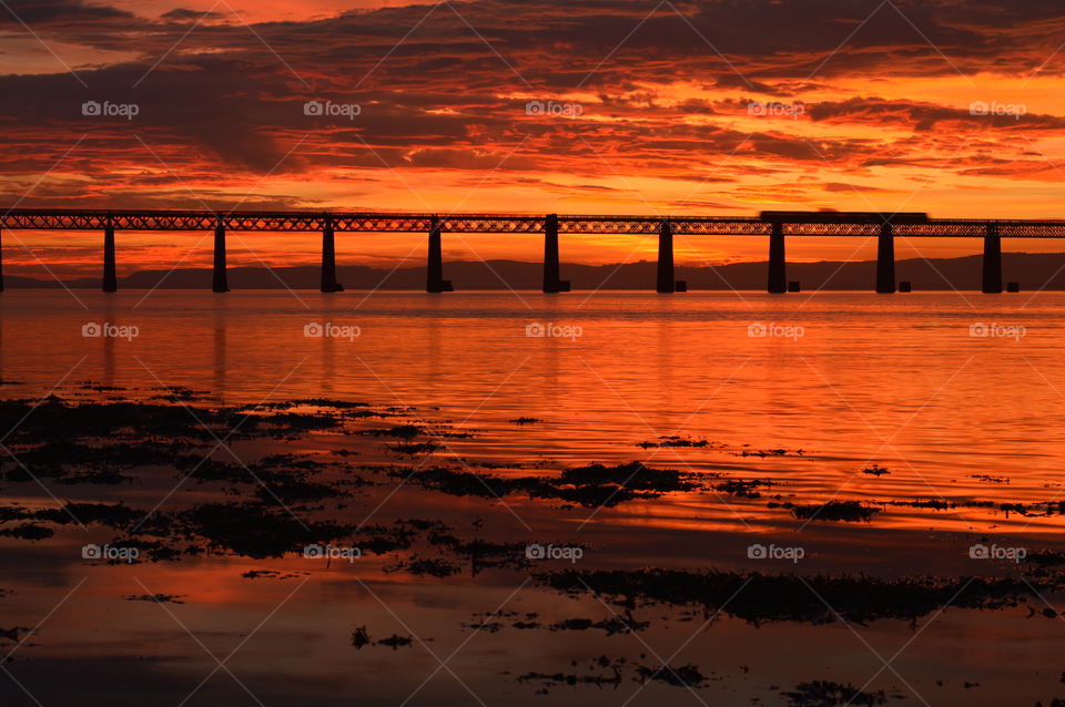 sunset over a bridge