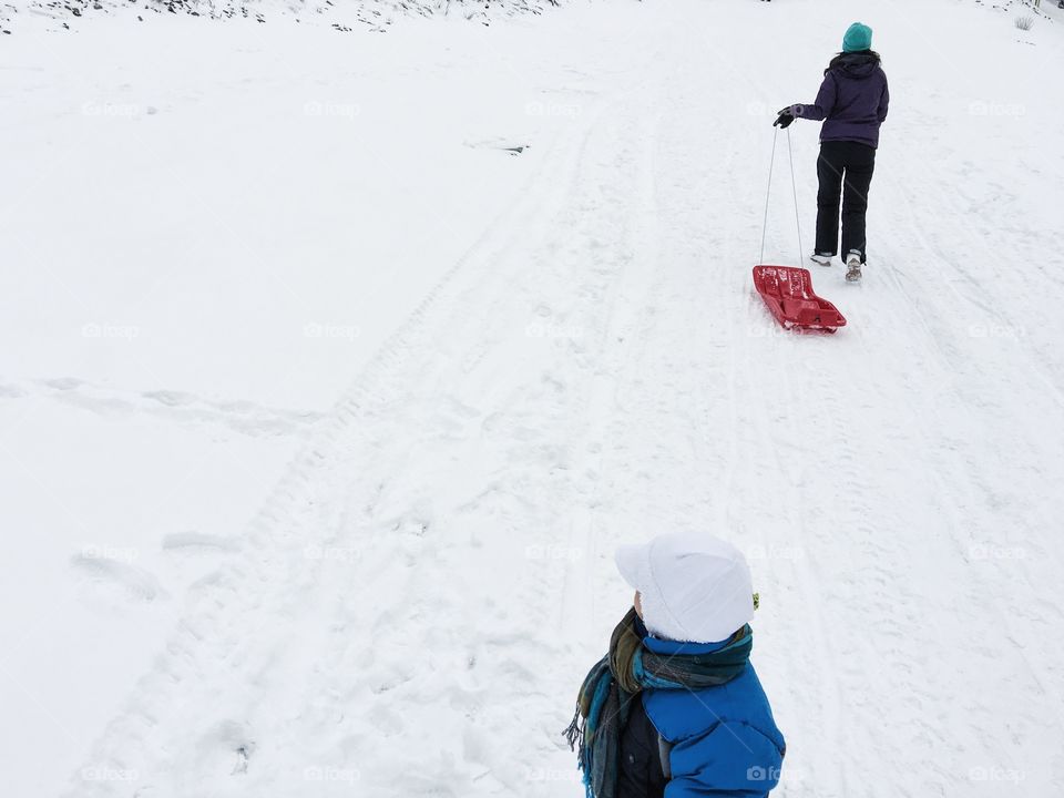 Person holding hand sled