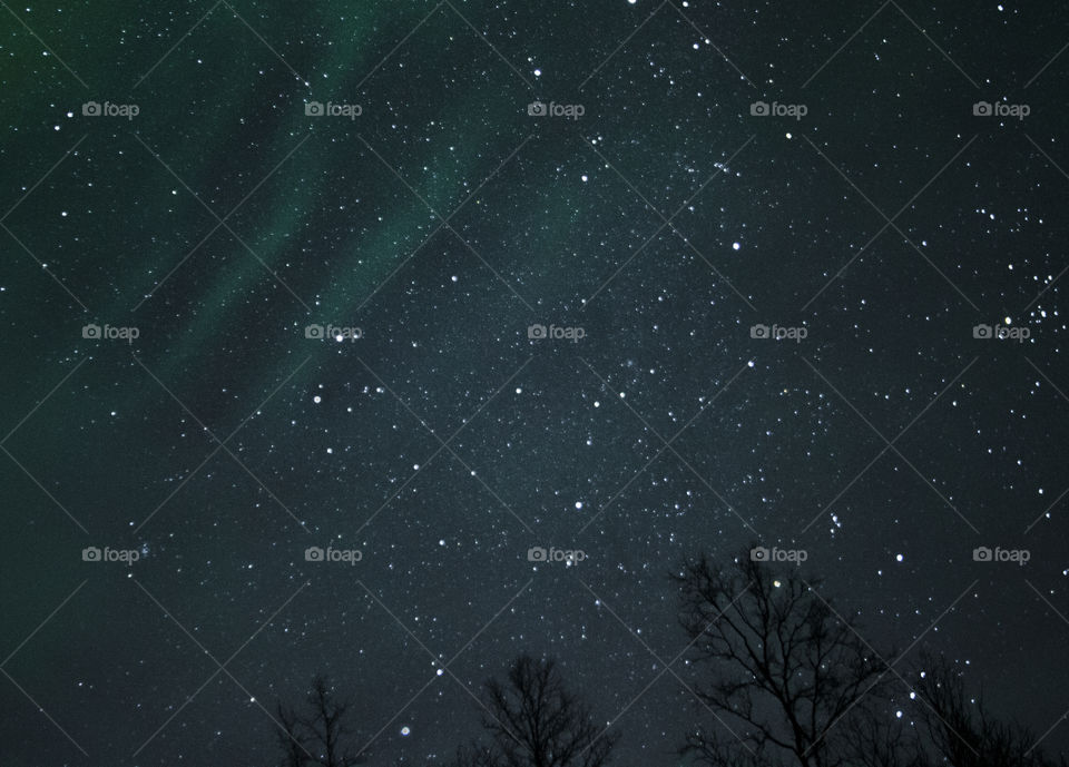 Stars at night with aurora borealis