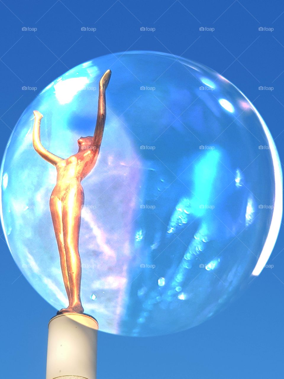 The lady in a sphere I created out of the statue photo and the selenite crystal photo. came together nicely.