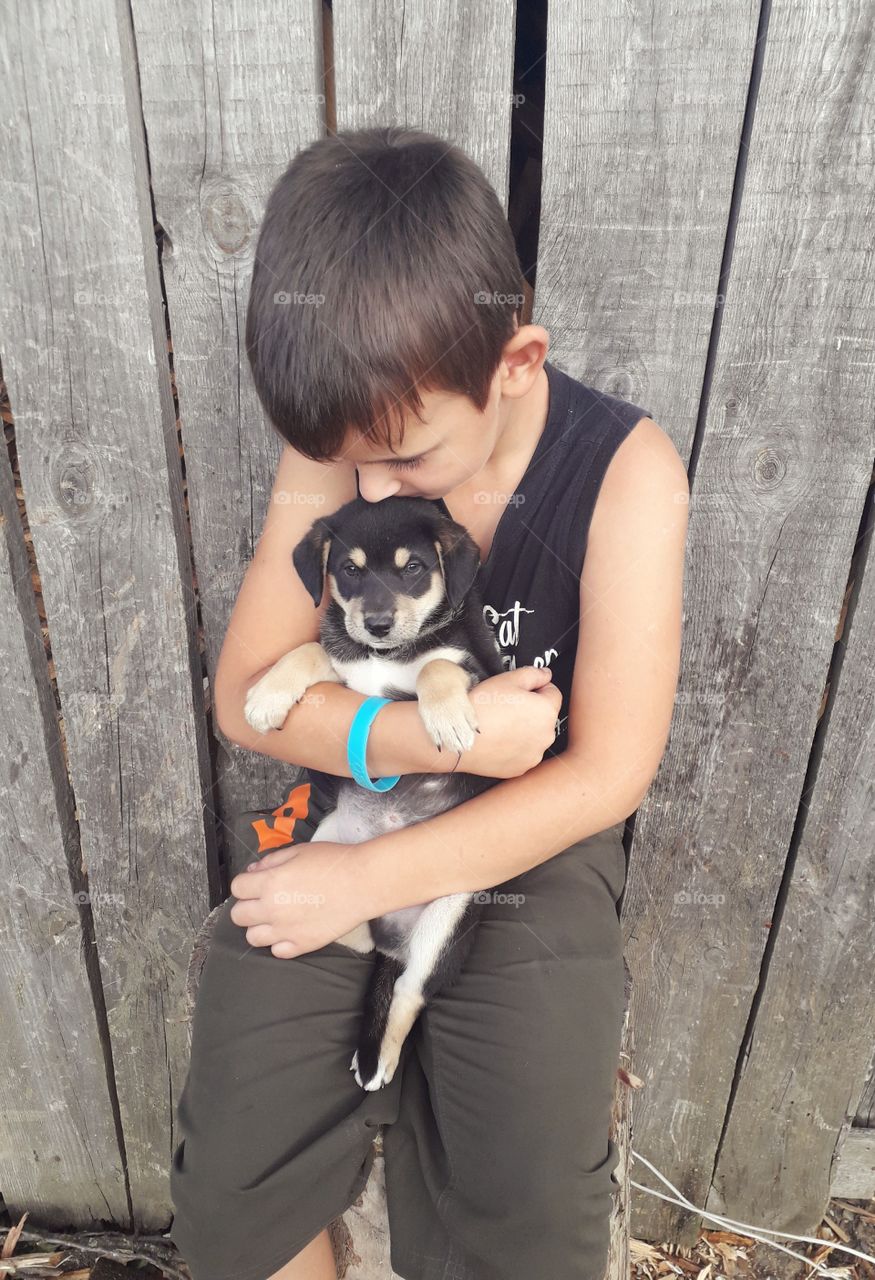 a boy with a puppy