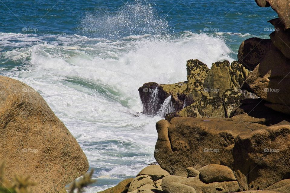 waves crashing on rocks