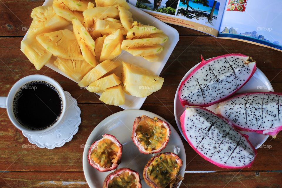 Exotic fruits with coffee for breakfast 