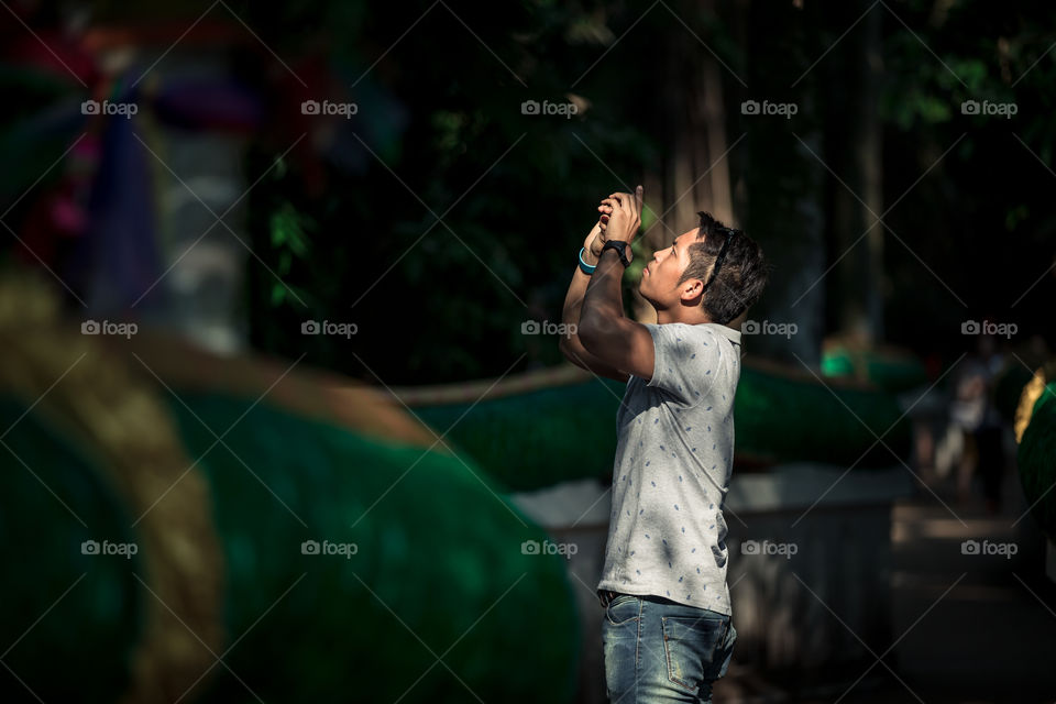 Tourist man talking a photograph