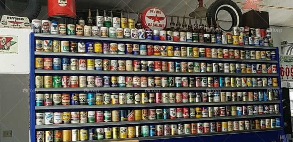 Display wall of antique oil cans