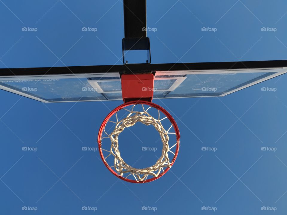 basketball hoops, shown from below the net.