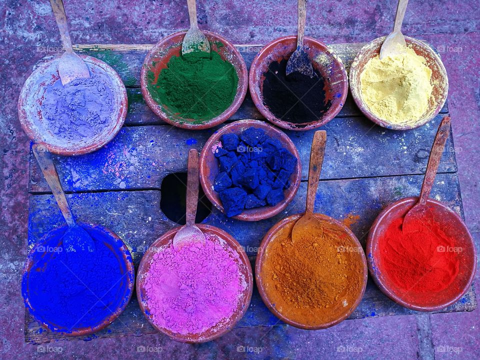 Bowls of dyes used to dye fabrics