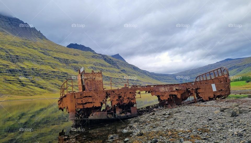 A rusty ship swreck on the beach
