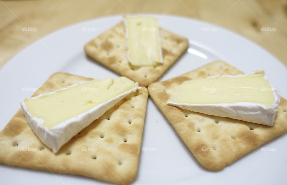 Cracker with Camembert cheese.
