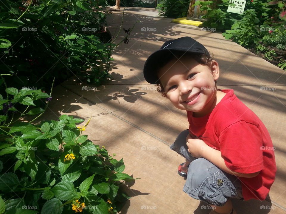 Smiling child enjoying nature.