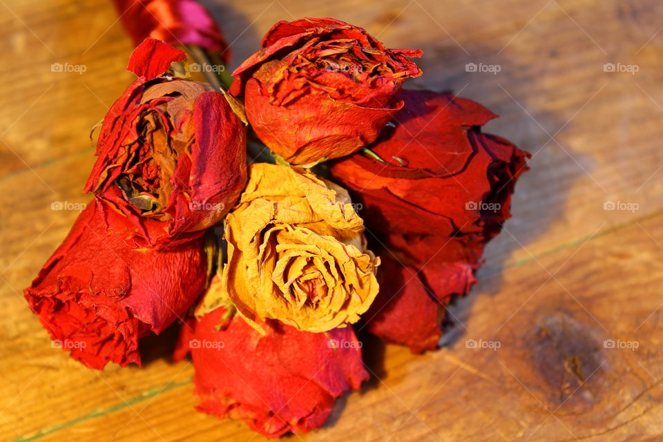 roses on wooden table