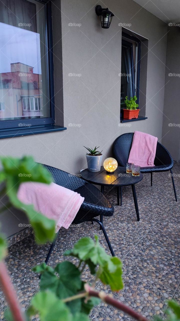 Cozy balcony setup for evening drinks