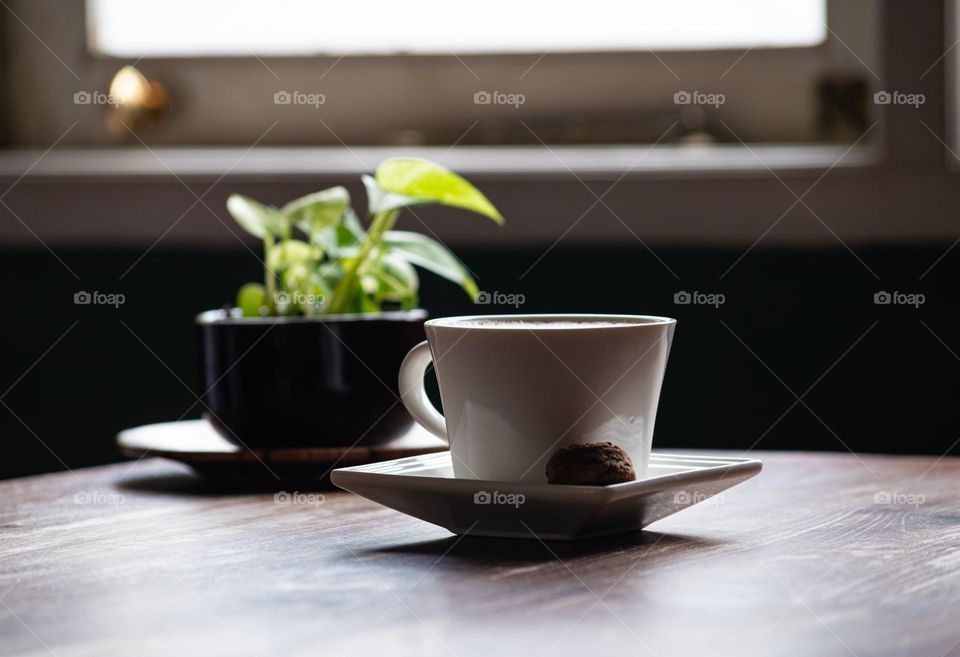 a cup of coffee on the table in the morning