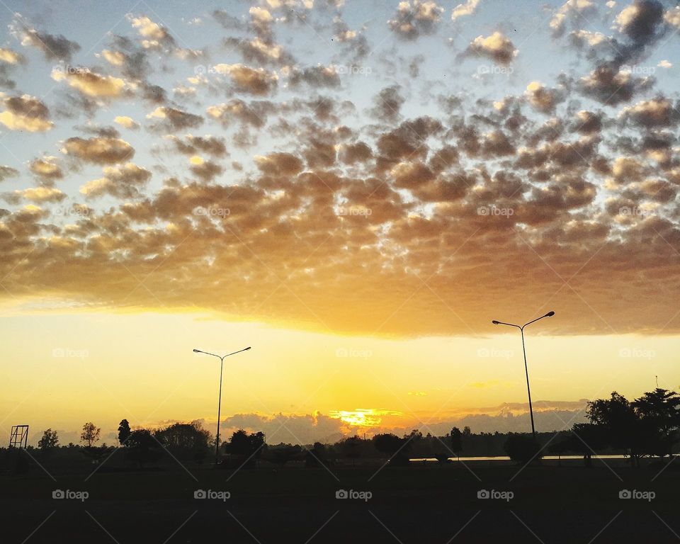 Scenic view of countryside against dramatic sky