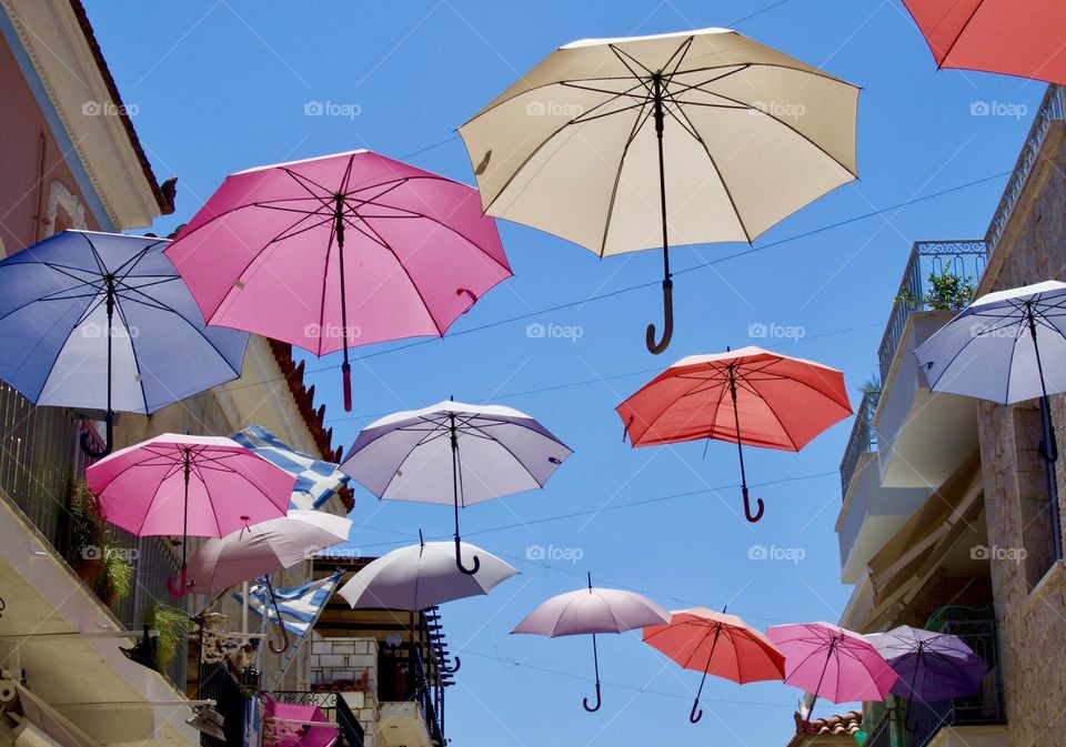 Repeating pattern, circles. Suspended umbrellas in Greece.