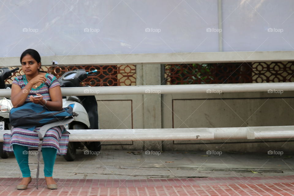 woman at rest waiting for bus