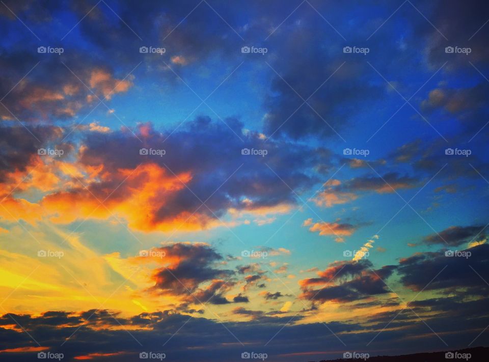 Low angle view of cloudy sky during sunset