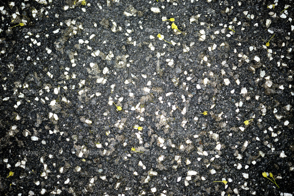 fullfram background of black asphalt with little grey stones.