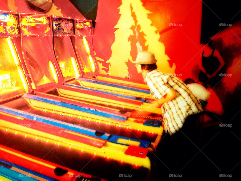 Kids playing games in an arcade